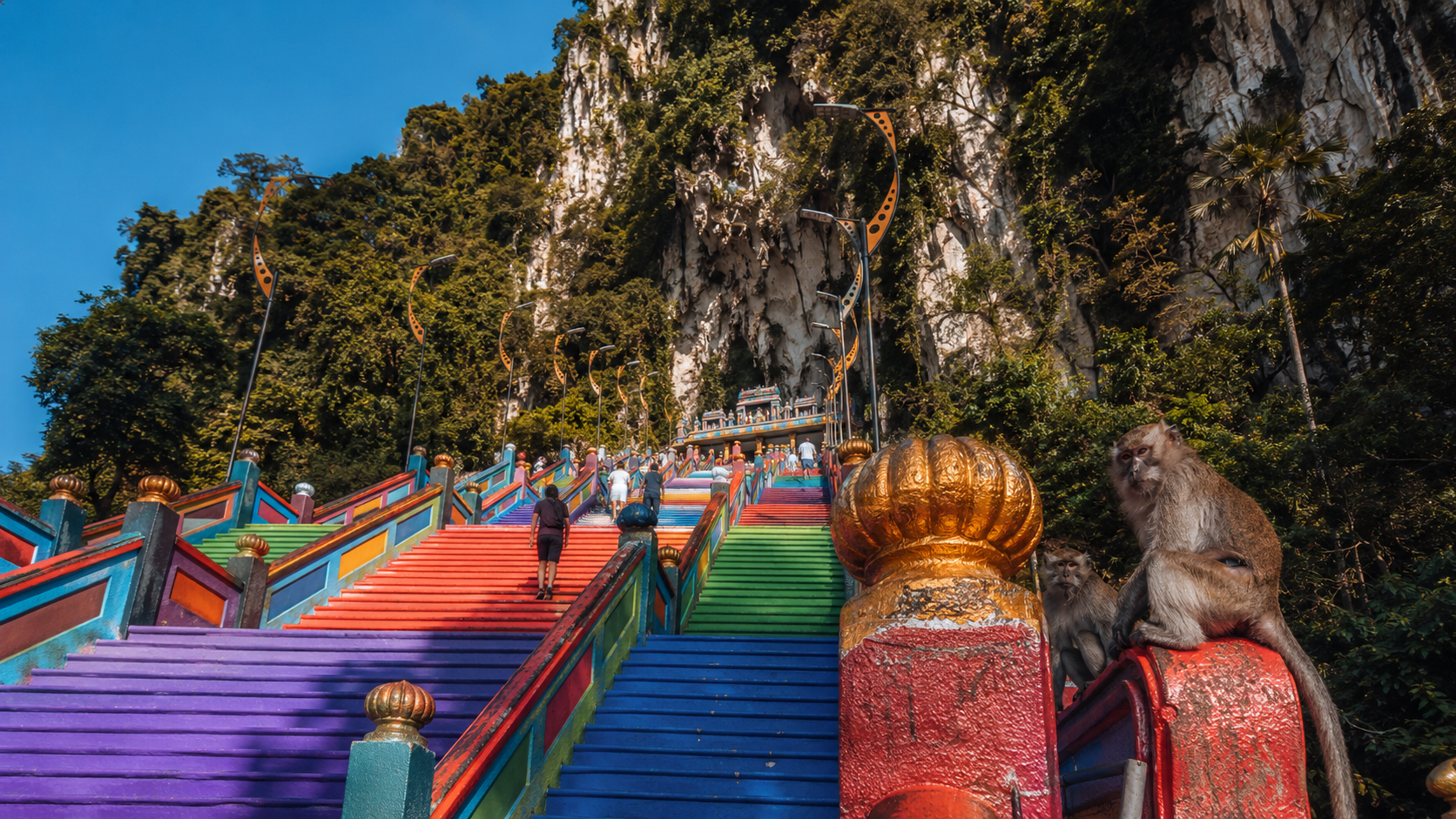 Batu Caves rainbow stairs Kuala Lumpur with macaque monkeys